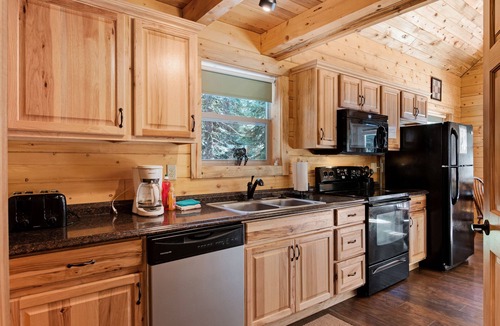 South Fork Cabin | Waterfront cabin with bridge, private hot tub, & WiFi - near National Forest