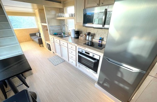 Pear Park House | XL tiny home with two lofted queen beds and full size futon on the main level.