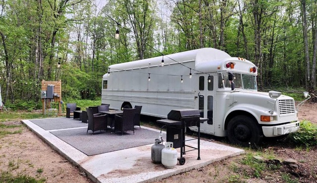 Rustic Converted School Bus with Outdoor Shower Near ORV Trails in Manistee National Forest, Michigan