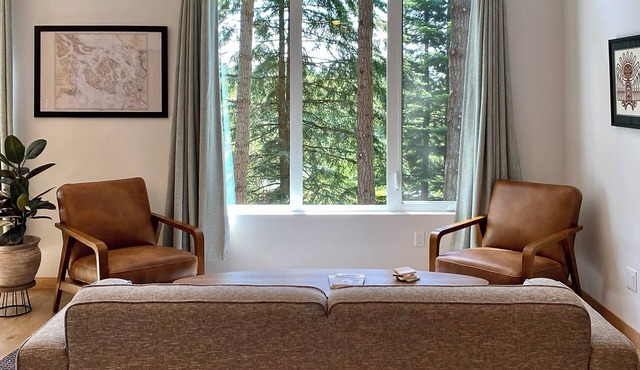 Stylish forest retreat on Orcas Island. Chef's kitchen, mid-century décor & a private deck among the firs. Two levels, forest views from every room. Minutes to Moran Park, Rosario Resort & Eastsound. Your perfect Pacific Northwest escape awaits.
