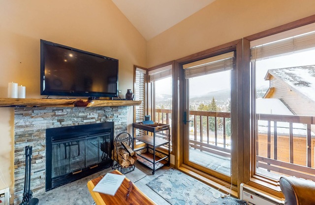 Ski-in/ski-out retreat with wraparound decks, hot tubs, ski views